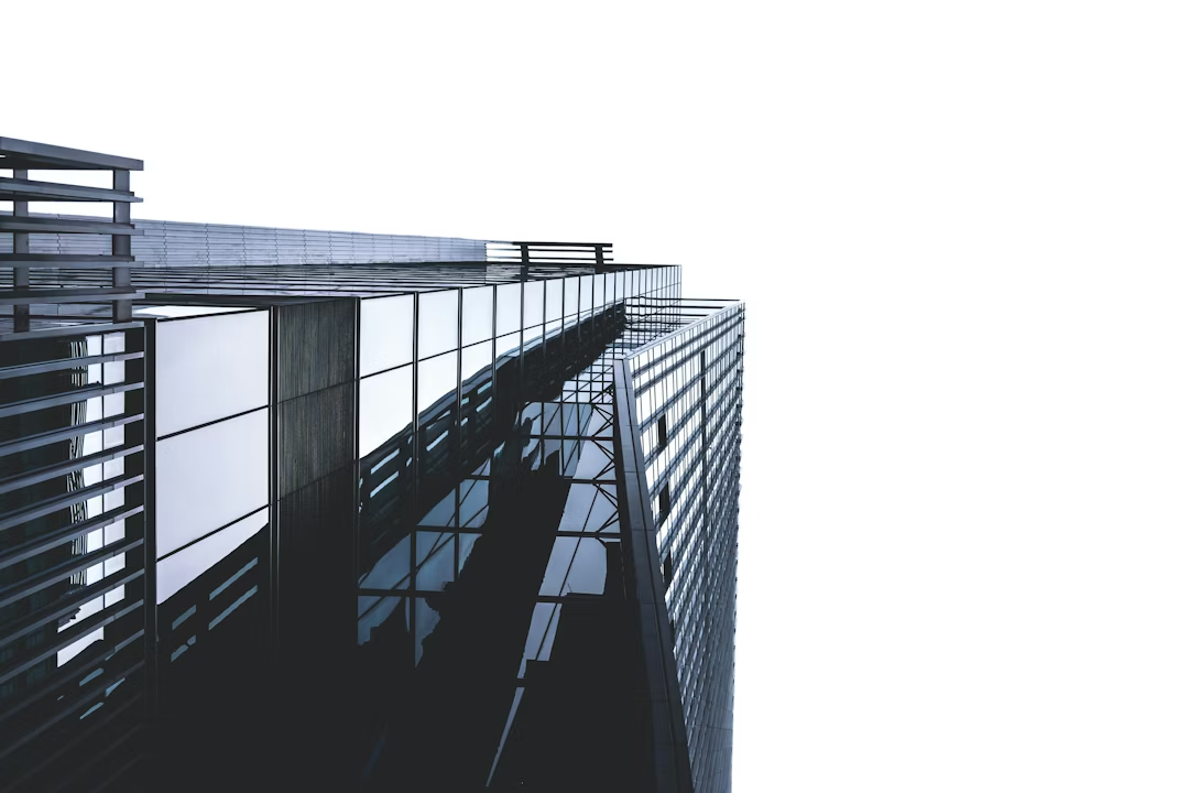 Modern glass office building exterior with steel balconies